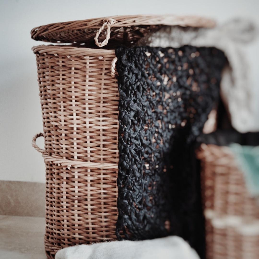 Wicker Round Laundry Basket Set with laundry inside